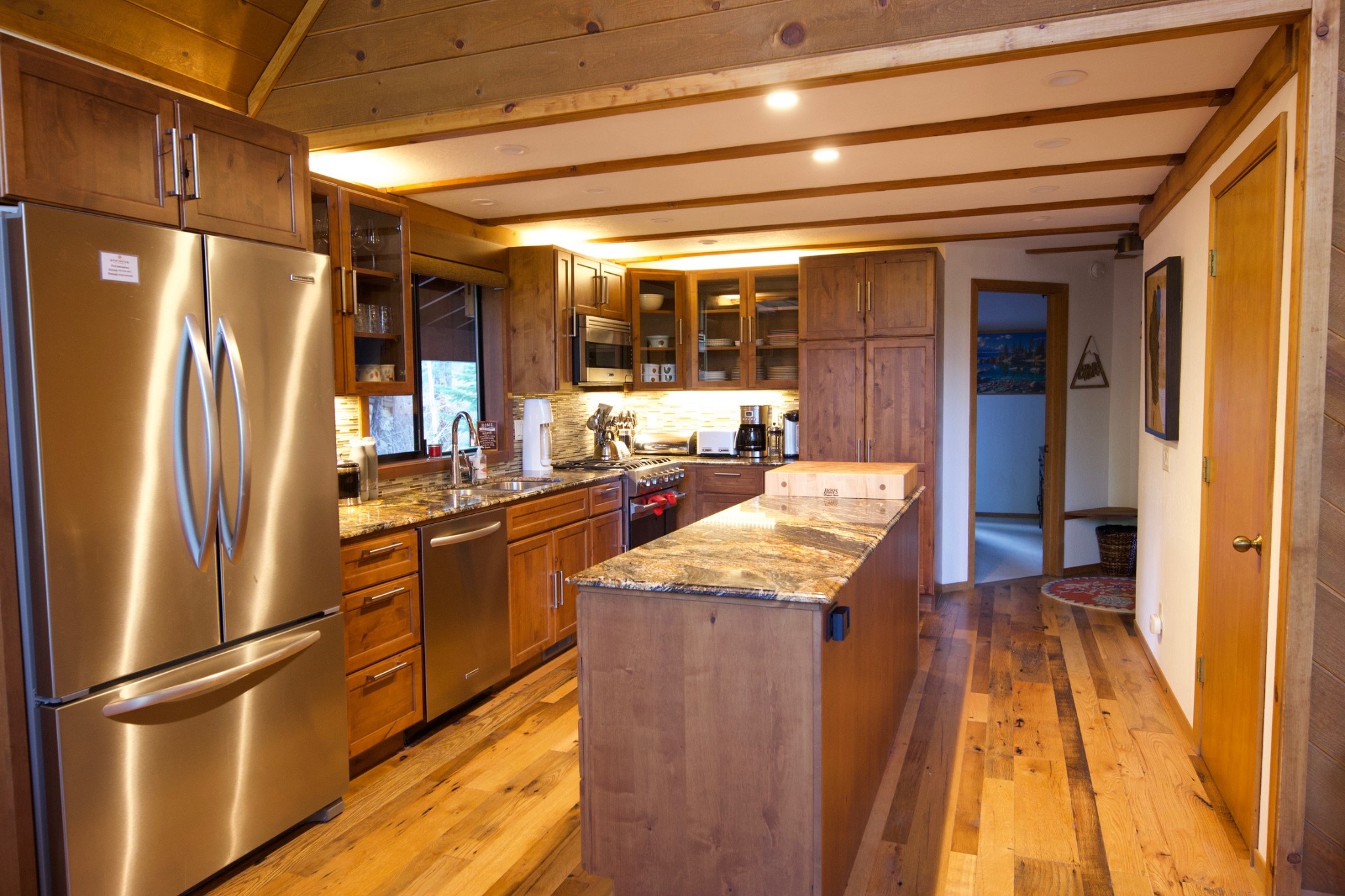 Full chef-friendly kitchen with island and stainless appliances